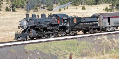 Steam locomotive, Southern Pacific number 1744, rolls along a track wearing the lettering of its previous owner, the San Luis and Rio Grande Railroad. The Niles Canyon Railway purchased the locomotive from them.